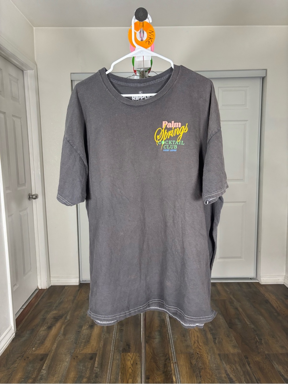 Ripple Junction Men's Black Graphic Tee with Yellow and Green Logo